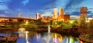 Downtown Tulsa at night showcasing some of Imagine Health's provider facilities.